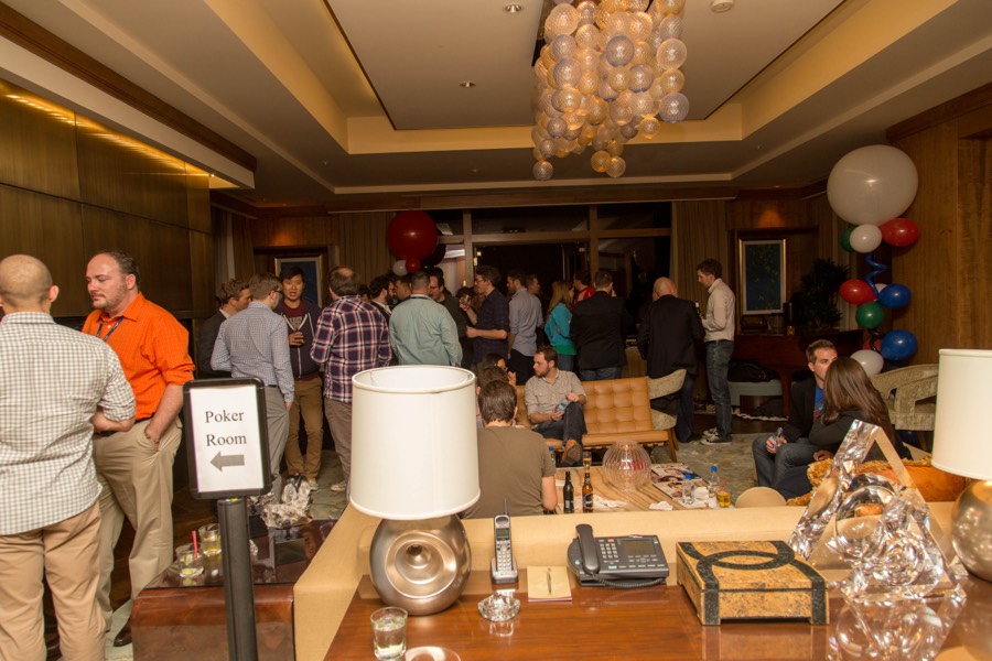 The Exosphere party suite — chandelier, balloons, and a Poker Room sign