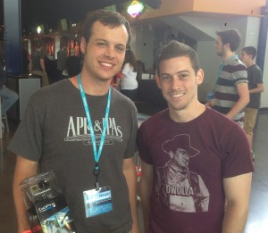 The Hack the Midwest 2013 winner holding his GoPro prize